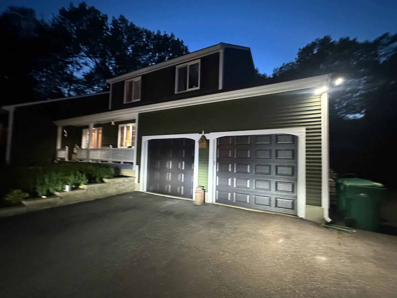 New carriage-house garage doors installed by Murray's, photographed the same evening
