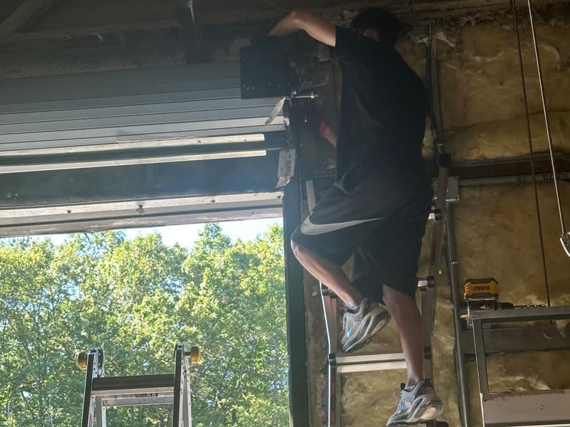 Row of commercial garage doors at storage facility