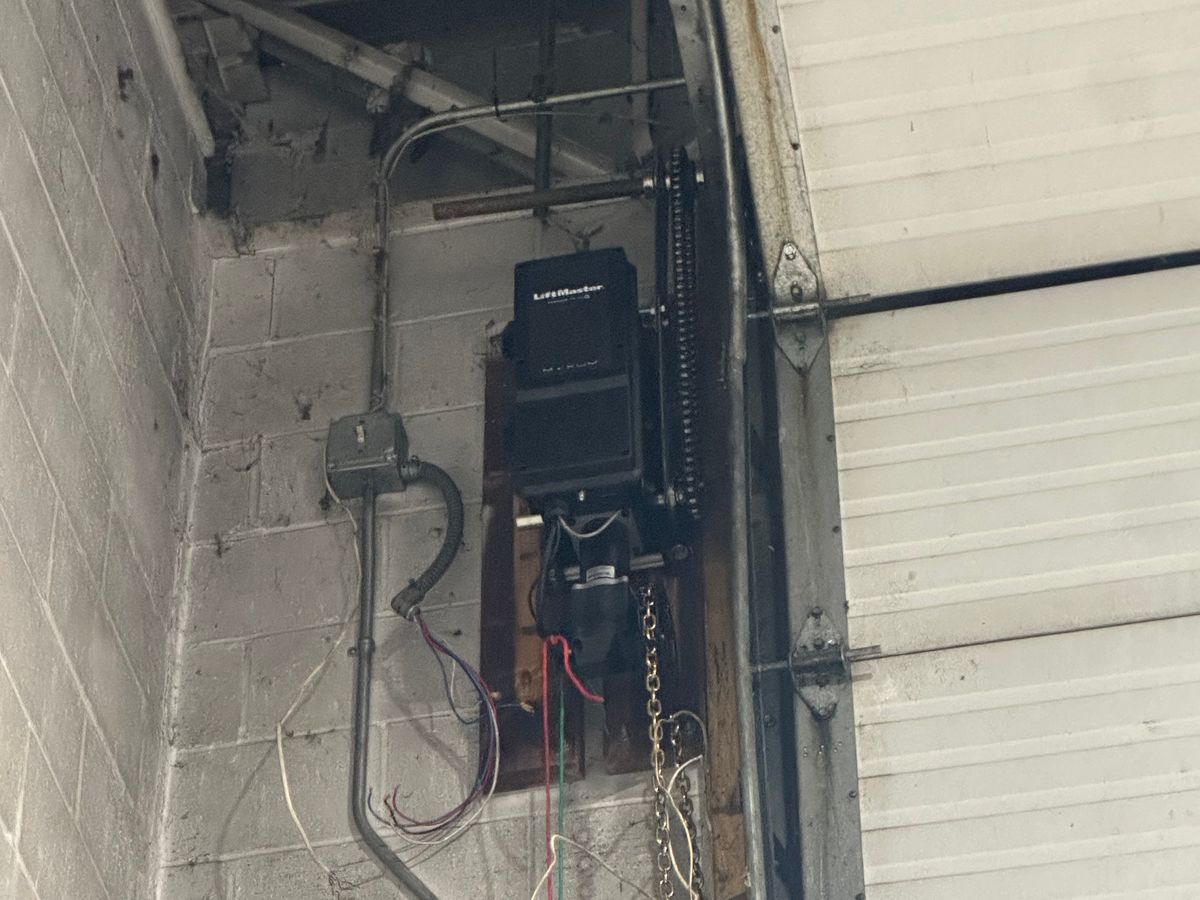 Close-up of LiftMaster opener motor and chain drive installation